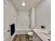 Clean bathroom with a bathtub and gray wood-look floors at 1441 Coen Ct, Columbus, IN 47201