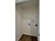 Small laundry room with hookups and wood-look floors at 1441 Coen Ct, Columbus, IN 47201