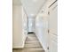 Clean hallway with light walls and wood-look floors at 1441 Coen Ct, Columbus, IN 47201
