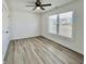 Simple bedroom with wood-look floors and large window at 1441 Coen Ct, Columbus, IN 47201