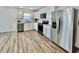 Modern kitchen with stainless steel appliances and light gray cabinets at 1441 Coen Ct, Columbus, IN 47201