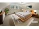 Virtually staged main bedroom with platform bed at 4343 N Arlington Ave, Indianapolis, IN 46226