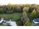Aerial view of property with large yard, showing house and outbuildings at 3231 W State Road 32, Westfield, IN 46074
