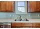 Modern kitchen sink with double basin and wood cabinets at 7189 Lockford N, Avon, IN 46123