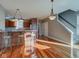Kitchen with hardwood floors, an island, and a breakfast bar at 7189 Lockford N, Avon, IN 46123