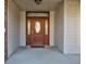 Rich wooden front door with glass accents at 7189 Lockford N, Avon, IN 46123