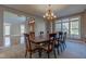 Bright dining room featuring hardwood floors, a large table, and access to living areas at 7189 Lockford N, Avon, IN 46123