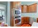 Kitchen features stainless steel appliances and ample wood cabinetry at 7189 Lockford N, Avon, IN 46123