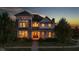 Two-story house with warm lighting, showcasing inviting interior at 7189 Lockford N, Avon, IN 46123