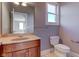 Main floor bathroom with single vanity and toilet at 7189 Lockford N, Avon, IN 46123