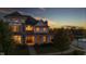 Two-story house with warm lighting, showcasing inviting interior at 7189 Lockford N, Avon, IN 46123