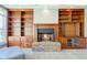 Bright living room with a fireplace and ample built-in shelving at 7189 Lockford N, Avon, IN 46123