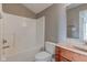 Simple bathroom with shower/tub combo and wood vanity at 7189 Lockford N, Avon, IN 46123