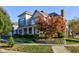 Two-story house with brick and siding, landscaping, and fall foliage at 7189 Lockford N, Avon, IN 46123