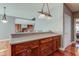 Kitchen island with cooktop and stainless steel appliances at 7189 Lockford N, Avon, IN 46123