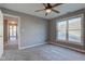 Well-lit bedroom with carpet flooring and access to hallway at 7189 Lockford N, Avon, IN 46123