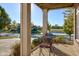 Covered patio with seating area overlooking a pond at 7189 Lockford N, Avon, IN 46123