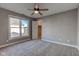 Bright bedroom featuring carpet, ceiling fan, and a walk-in closet at 7189 Lockford N, Avon, IN 46123