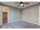 Simple bedroom with carpet, ceiling fan and closet at 7189 Lockford N, Avon, IN 46123