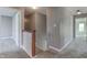 Upstairs hallway with carpet and access to bedrooms at 7189 Lockford N, Avon, IN 46123