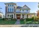 Two-story house with brick and siding, front porch, and landscaping at 7189 Lockford N, Avon, IN 46123