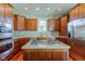 Spacious kitchen with island, stainless steel appliances, and wood cabinets at 7189 Lockford N, Avon, IN 46123
