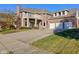 Brick two-story house with three-car garage and balcony at 7189 Lockford N, Avon, IN 46123
