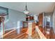 Kitchen boasts hardwood floors, an island, and a breakfast bar at 7189 Lockford N, Avon, IN 46123