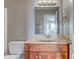 Clean bathroom with wood vanity and a mirrored medicine cabinet at 7189 Lockford N, Avon, IN 46123