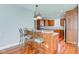 Kitchen with wood cabinetry, breakfast bar, and stainless steel appliances at 7189 Lockford N, Avon, IN 46123