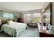 Main bedroom with ample natural light and wood furniture at 4024 W South Wood Lake Dr, Columbus, IN 47201
