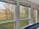 Bright sunroom with stunning views of the lake and woods at 4024 W South Wood Lake Dr, Columbus, IN 47201