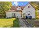 Back of house with deck, walkway, and fenced yard at 1912 N A St, Elwood, IN 46036