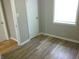 Bedroom with wood-look flooring and neutral walls at 309 S Fleming St, Indianapolis, IN 46241