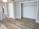 Bedroom with walk-in closet and wood-look flooring at 309 S Fleming St, Indianapolis, IN 46241