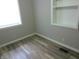 Bedroom with built-in shelving and large window at 309 S Fleming St, Indianapolis, IN 46241