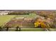 Aerial view of property with barns and surrounding land showing fall colors at 345 S 775 E, Zionsville, IN 46077