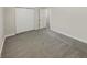 Spacious bedroom with grey carpet and double door closet at 926 Stockton St, Indianapolis, IN 46260