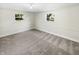 Finished basement with neutral carpeting and natural light at 926 Stockton St, Indianapolis, IN 46260