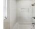Clean bathroom with white tiled shower and bathtub at 926 Stockton St, Indianapolis, IN 46260