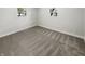 Well-lit bedroom with neutral carpeting and window views at 926 Stockton St, Indianapolis, IN 46260