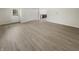 Spacious living area with hardwood floors and access to backyard at 926 Stockton St, Indianapolis, IN 46260