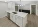 Modern kitchen featuring white cabinets, quartz countertops, and stainless steel appliances at 926 Stockton St, Indianapolis, IN 46260