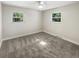 Bright bedroom with grey carpet and ceiling fan at 926 Stockton St, Indianapolis, IN 46260