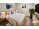 Virtually staged bedroom with light wood furniture and a neutral color scheme at 926 Stockton St, Indianapolis, IN 46260