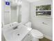 Modern bathroom with white vanity, toilet and shower at 926 Stockton St, Indianapolis, IN 46260
