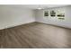Bright living room featuring hardwood floors and large windows at 926 Stockton St, Indianapolis, IN 46260