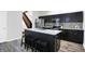 Modern kitchen with stainless steel appliances and an island with seating at 1007 Broadway St, Indianapolis, IN 46202