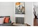 Modern fireplace with gray metal screen and artwork above at 1007 Broadway St, Indianapolis, IN 46202