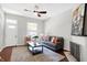 Living room with gray couch, coffee table, and hardwood floors at 1007 Broadway St, Indianapolis, IN 46202